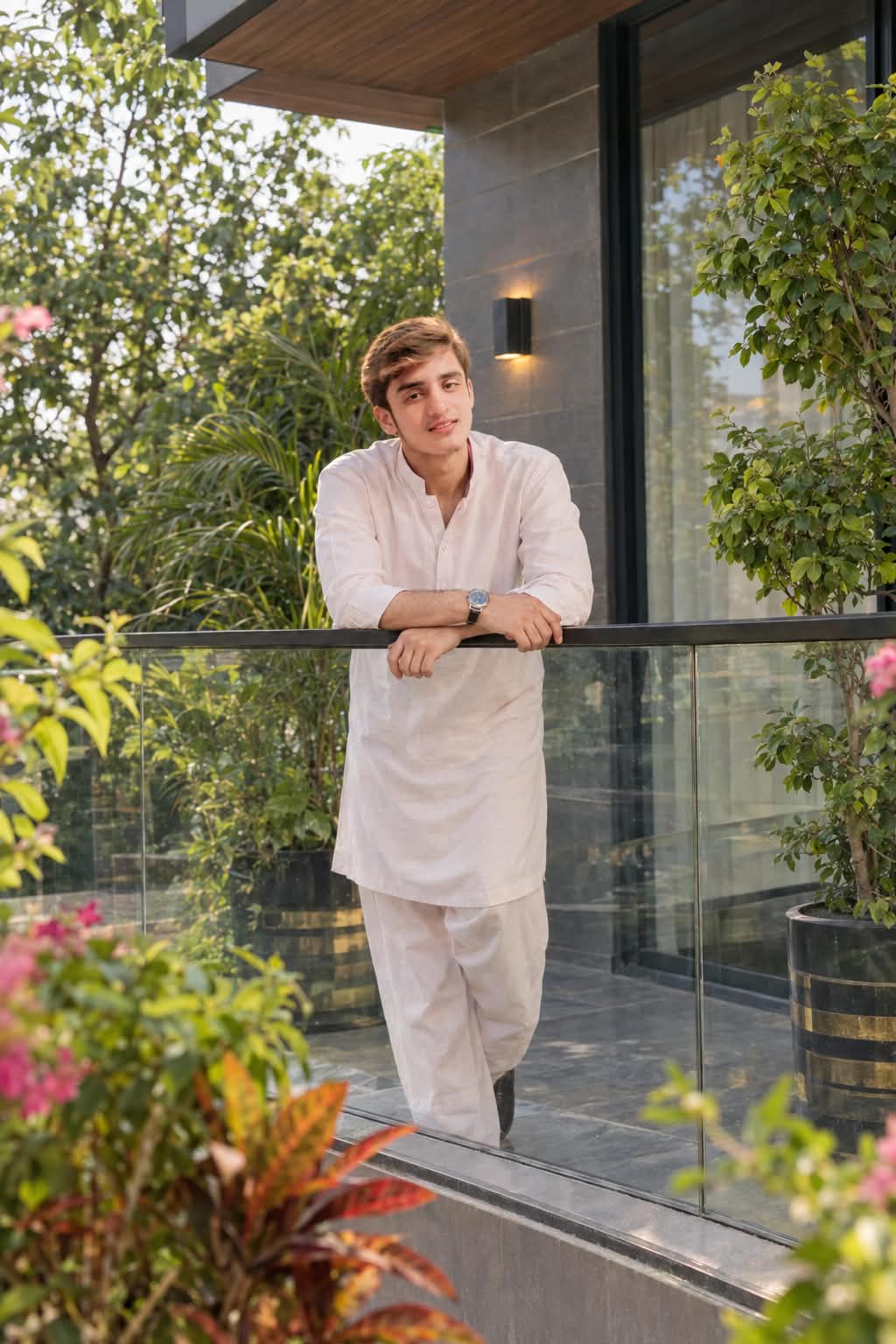 Saqib Shahzad standing in a garden setting